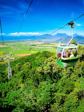 Skyrail Rainforest Cableway over lush forest in Cairns, Australia.