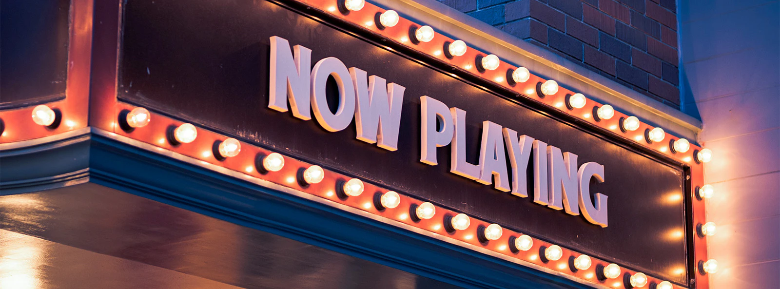 Marquee with "Now Playing" sign for Off Broadway shows in New York 2023.