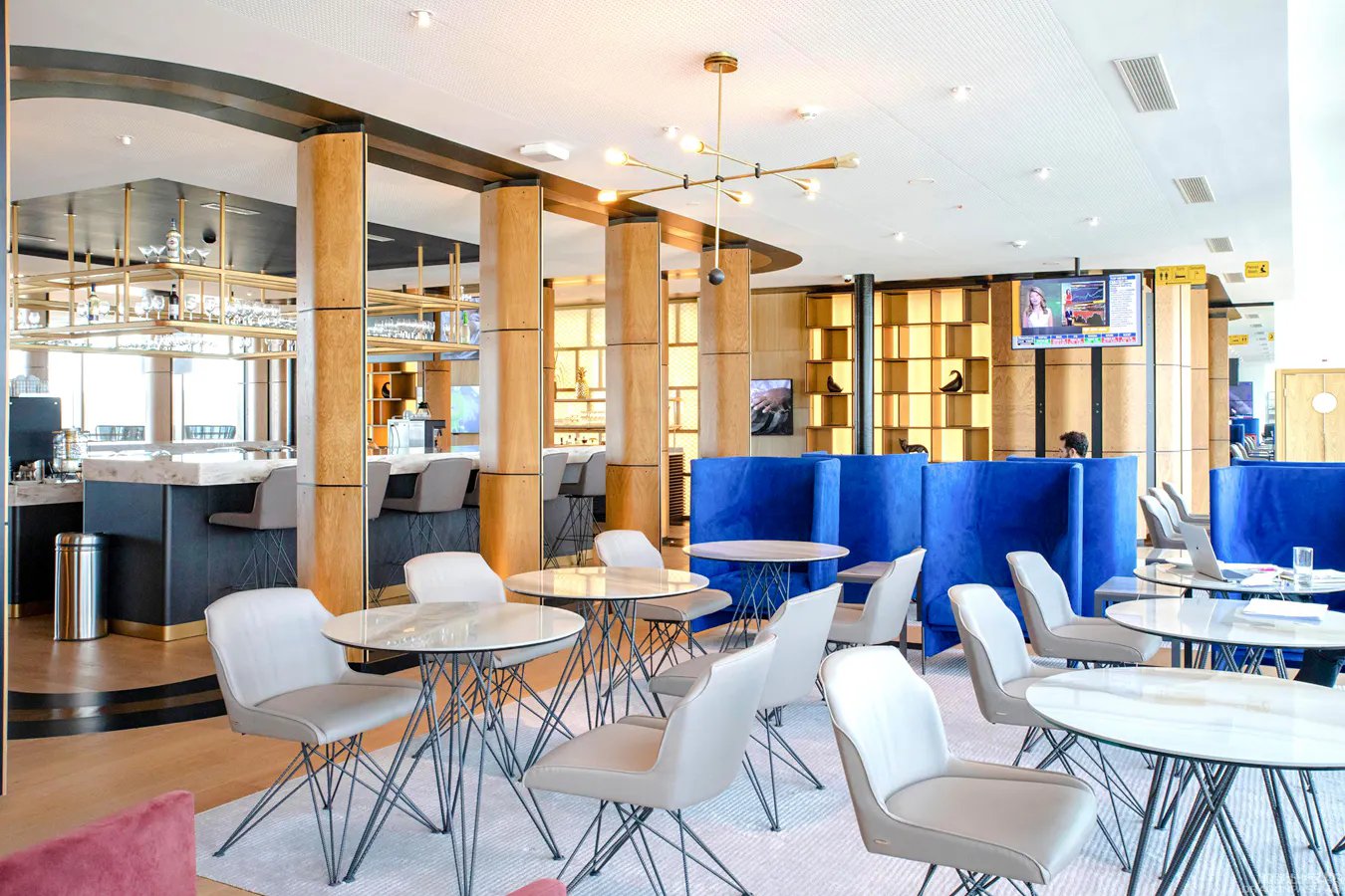 Zurich Airport VIP Lounge with modern seating and bar area.