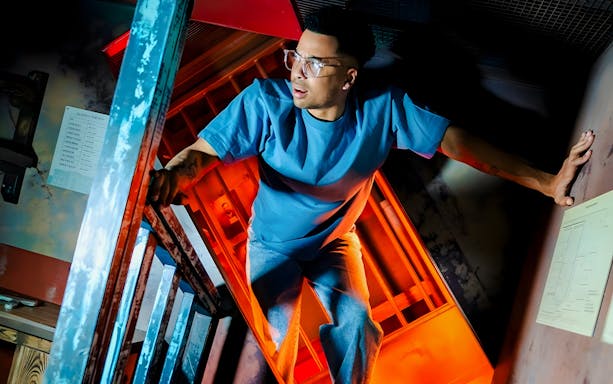 Man exploring an escape room at Prison Island Melbourne.