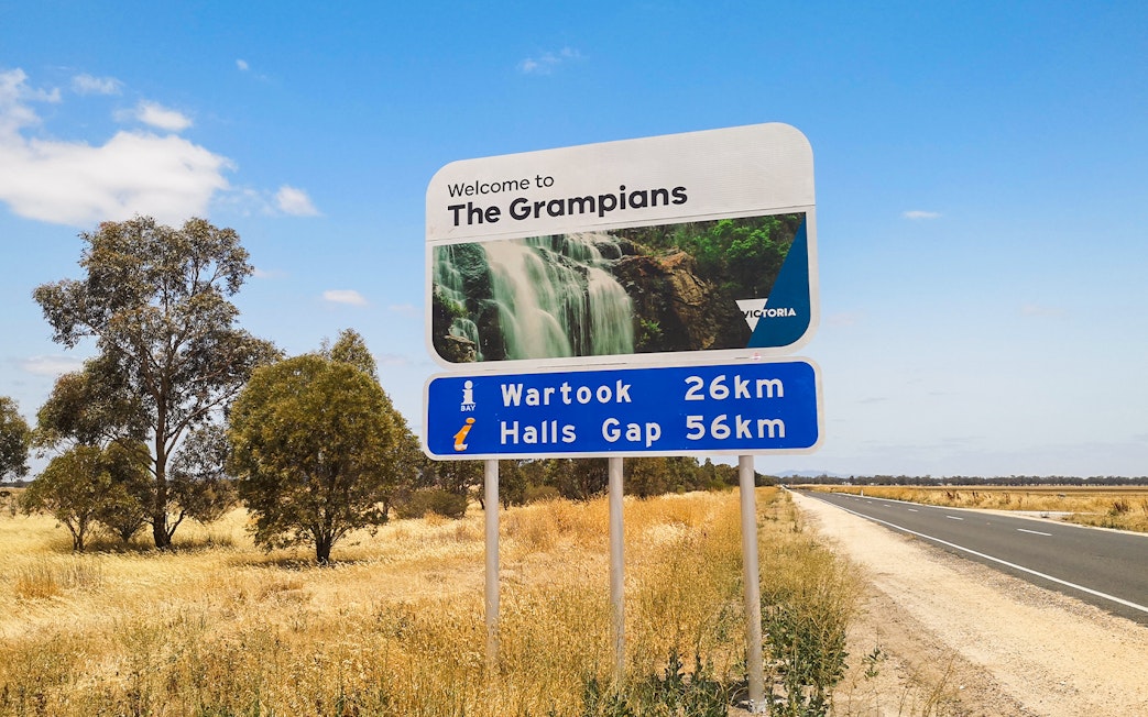 Welcome sign to The Grampians with distance to Wartook and Halls Gap, Australia.
