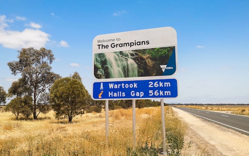 Welcome sign to The Grampians with distance to Wartook and Halls Gap, Australia.