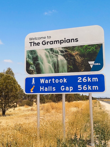 Welcome sign to The Grampians with distance to Wartook and Halls Gap, Australia.