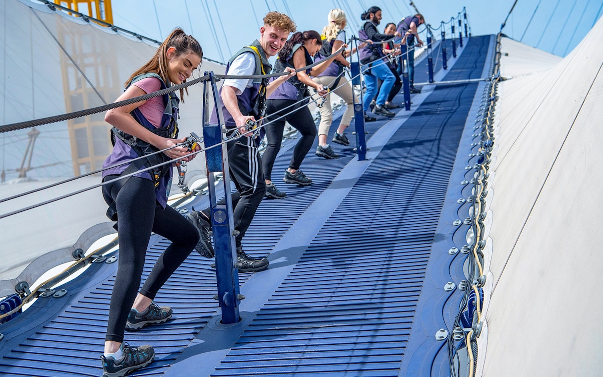 Visitors climbing the O2 Arena summit walkway in London.