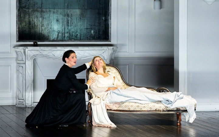 Opera performers in a dramatic scene from La Traviata at Sydney Opera House.
