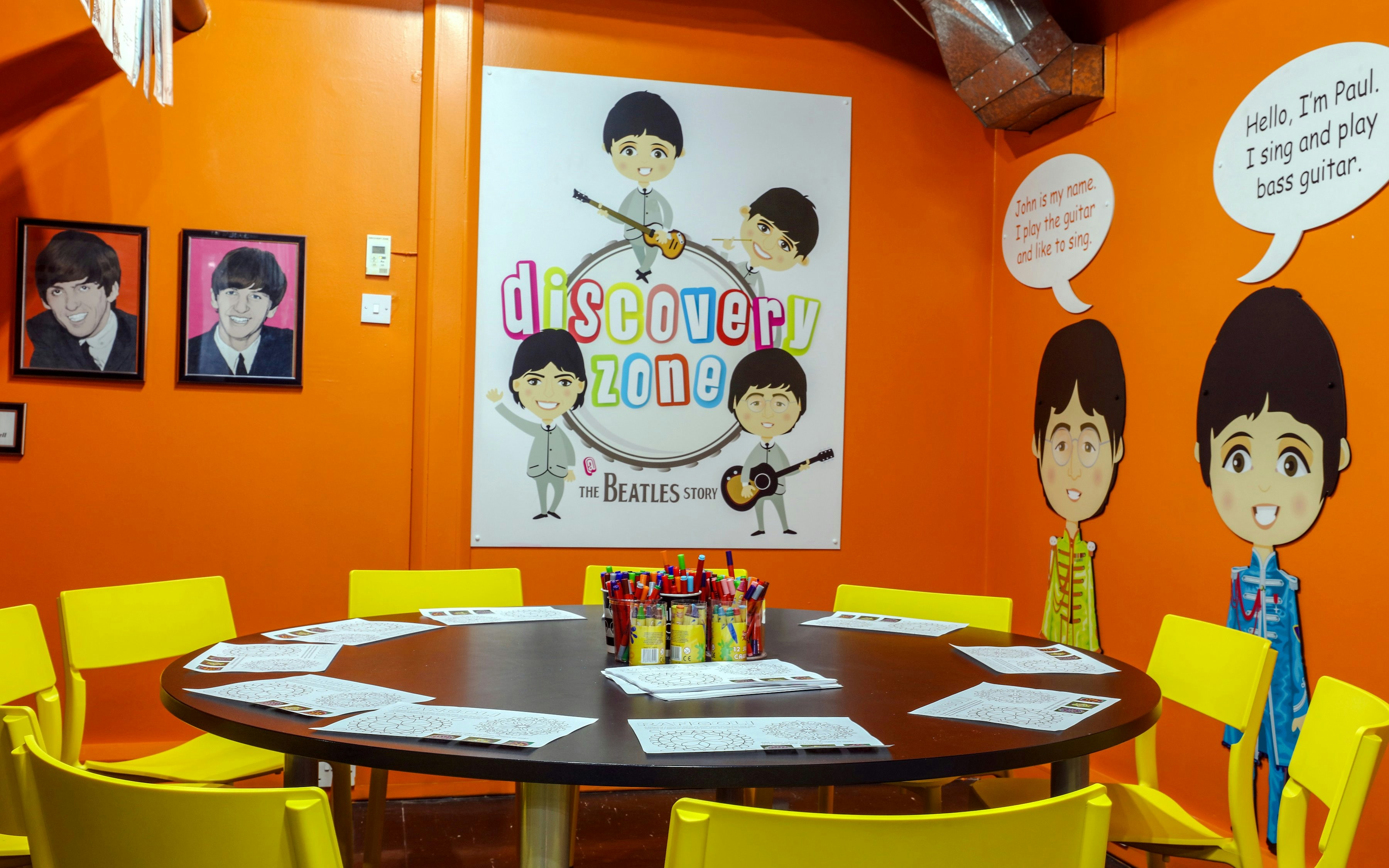 Discovery Zone at The Beatles Story with colorful decor and activity table.