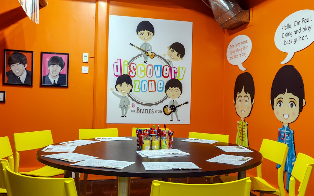 Discovery Zone at The Beatles Story with colorful decor and activity table.