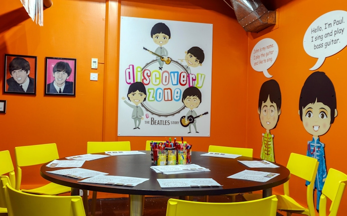 Discovery Zone at The Beatles Story with colorful decor and activity table.