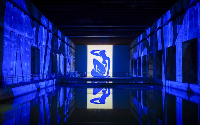 Matisse artwork projected in blue at Bassins des Lumières exhibition.