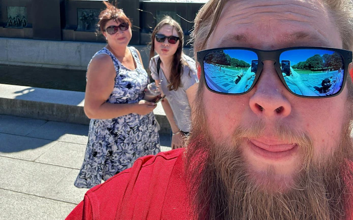 Visitors enjoying Oslo's Vigeland Park during a self-guided city exploration game.