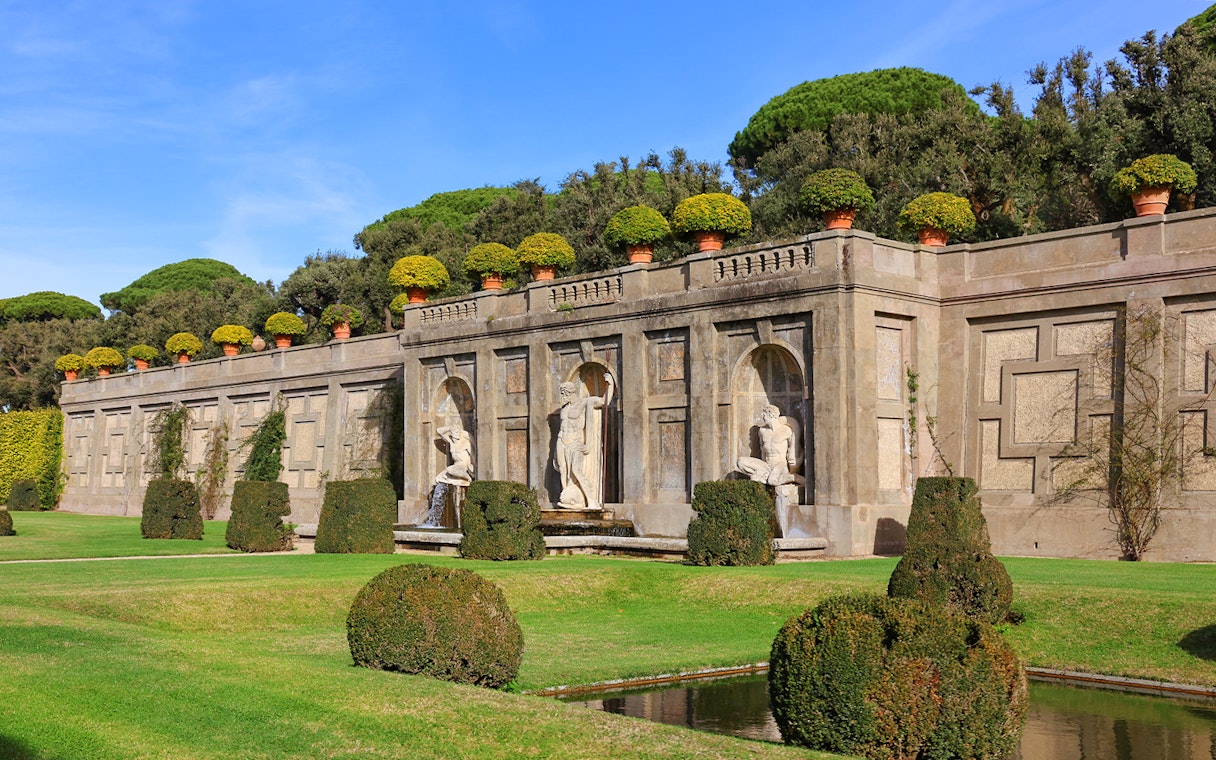 Statues and manicured hedges in the Gardens of Castel Gandolfo, Italy.