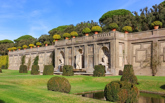 Statues and manicured hedges in the Gardens of Castel Gandolfo, Italy.