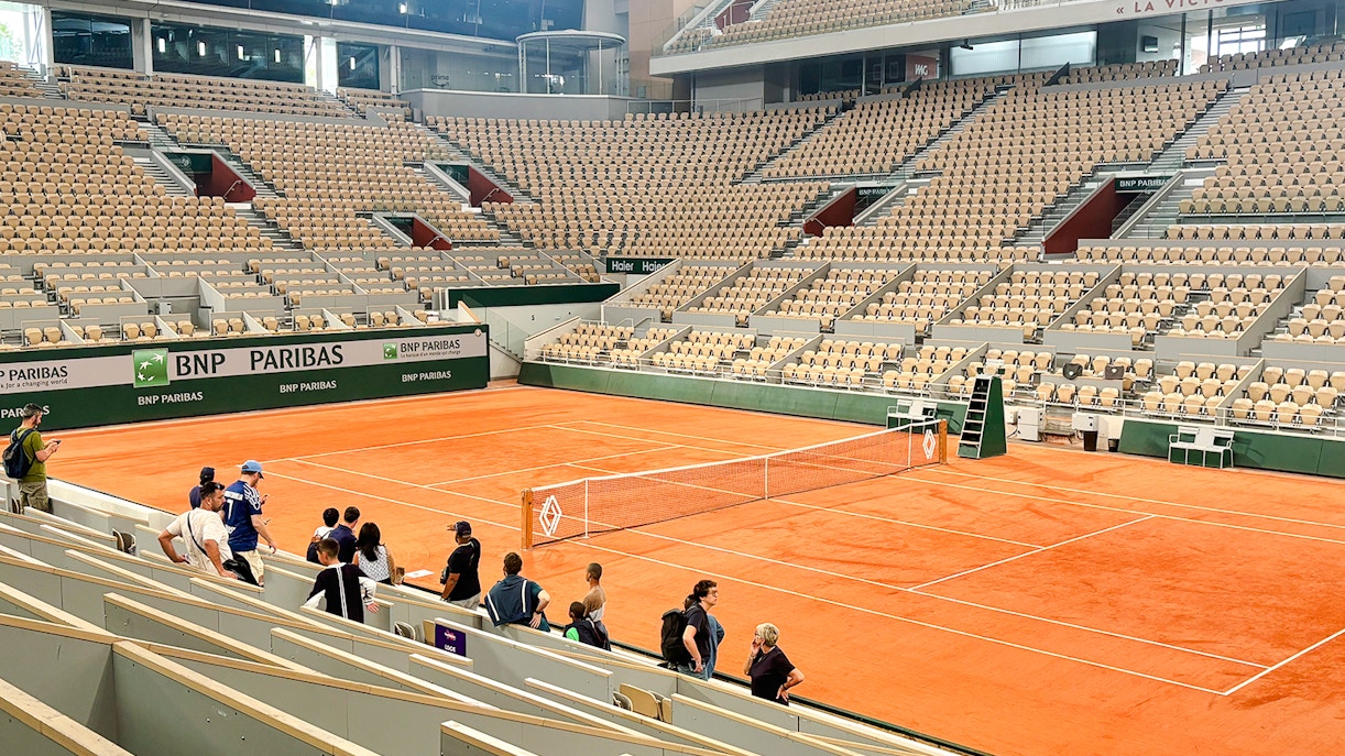 Roland Garros stadium with visitors viewing the Yannick Noah tribute mural.