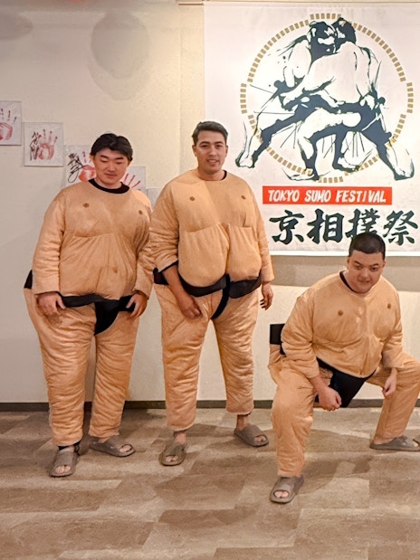 Tourists in sumo suits at Tokyo Sumo Festival in Ginza.