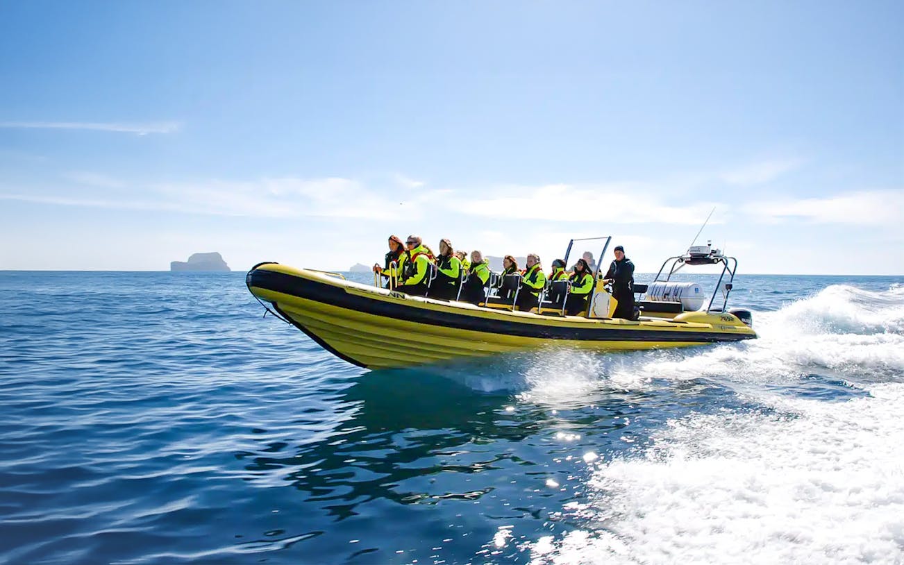 Guests on RIB speedboat in Reykjavik heading to whale watching.