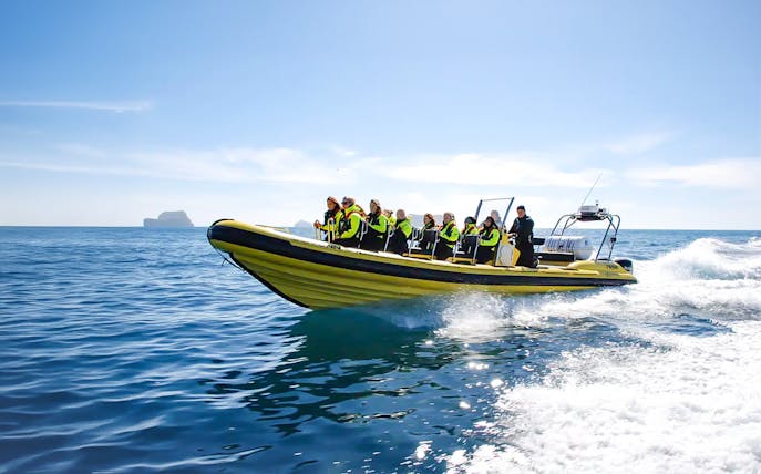Guests on RIB speedboat in Reykjavik heading to whale watching.