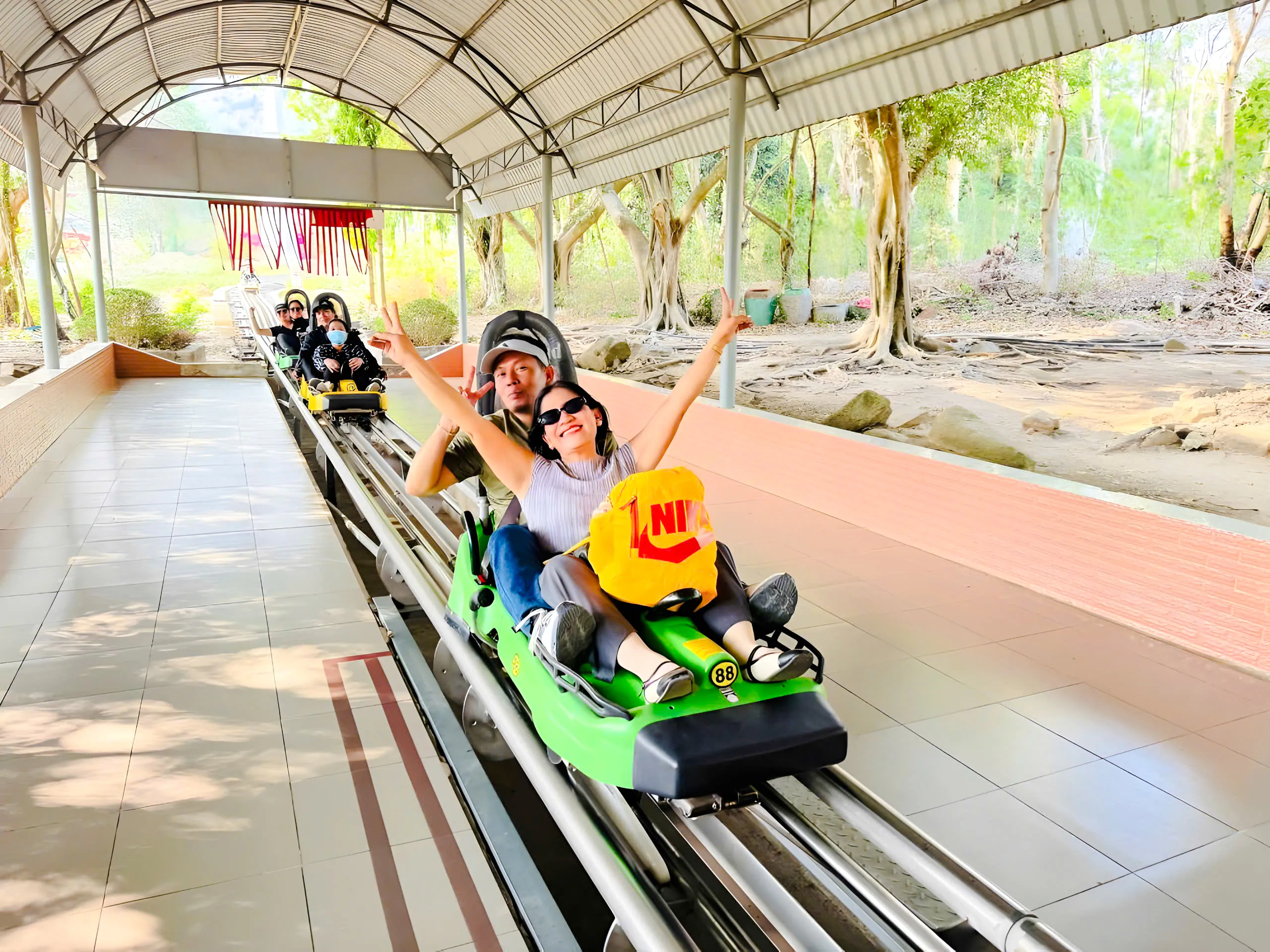 Visitors enjoying a roller coaster ride at Black Virgin Mountain, Tay Ninh.