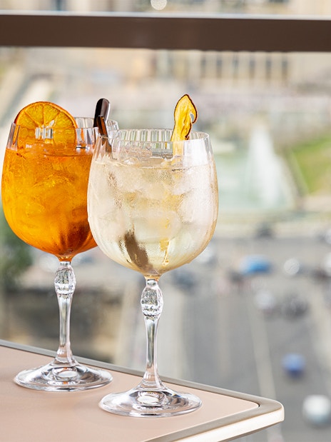 Cocktails on a table with a view from Madame Brasserie, Eiffel Tower, Paris.