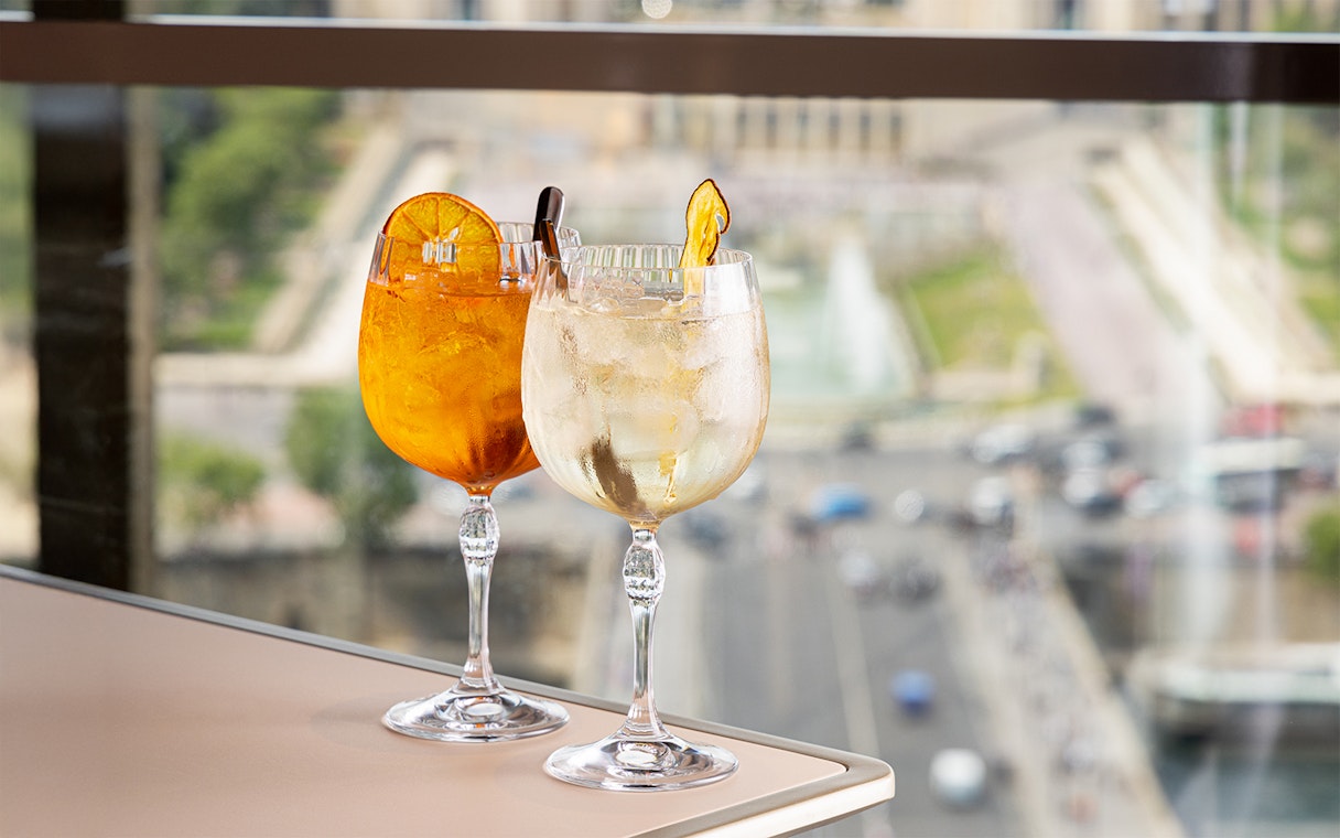 Cocktails on a table with a view from Madame Brasserie, Eiffel Tower, Paris.