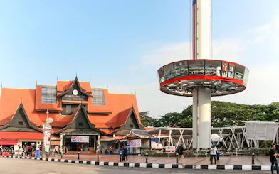 Tourists viewing Melaka from Menara Taming Sari tower.