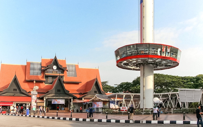 Tourists viewing Melaka from Menara Taming Sari tower.