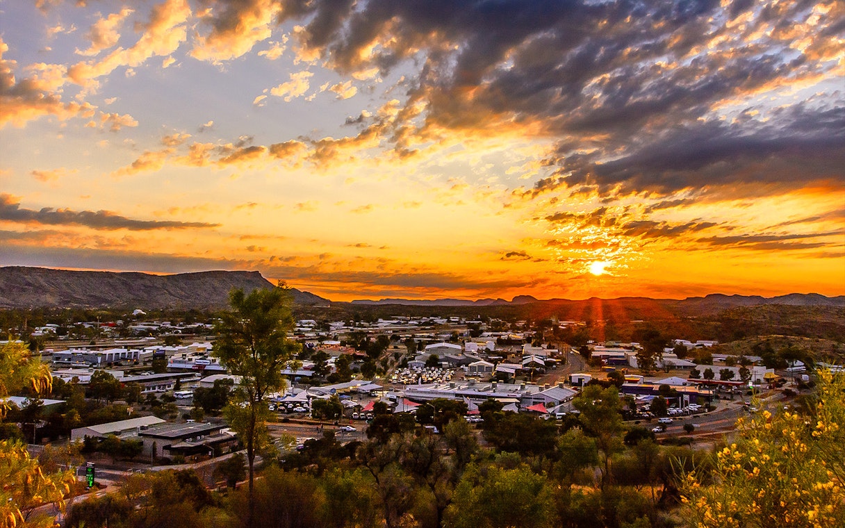 Alice Springs townscape at sunset during a half-day guided tour.