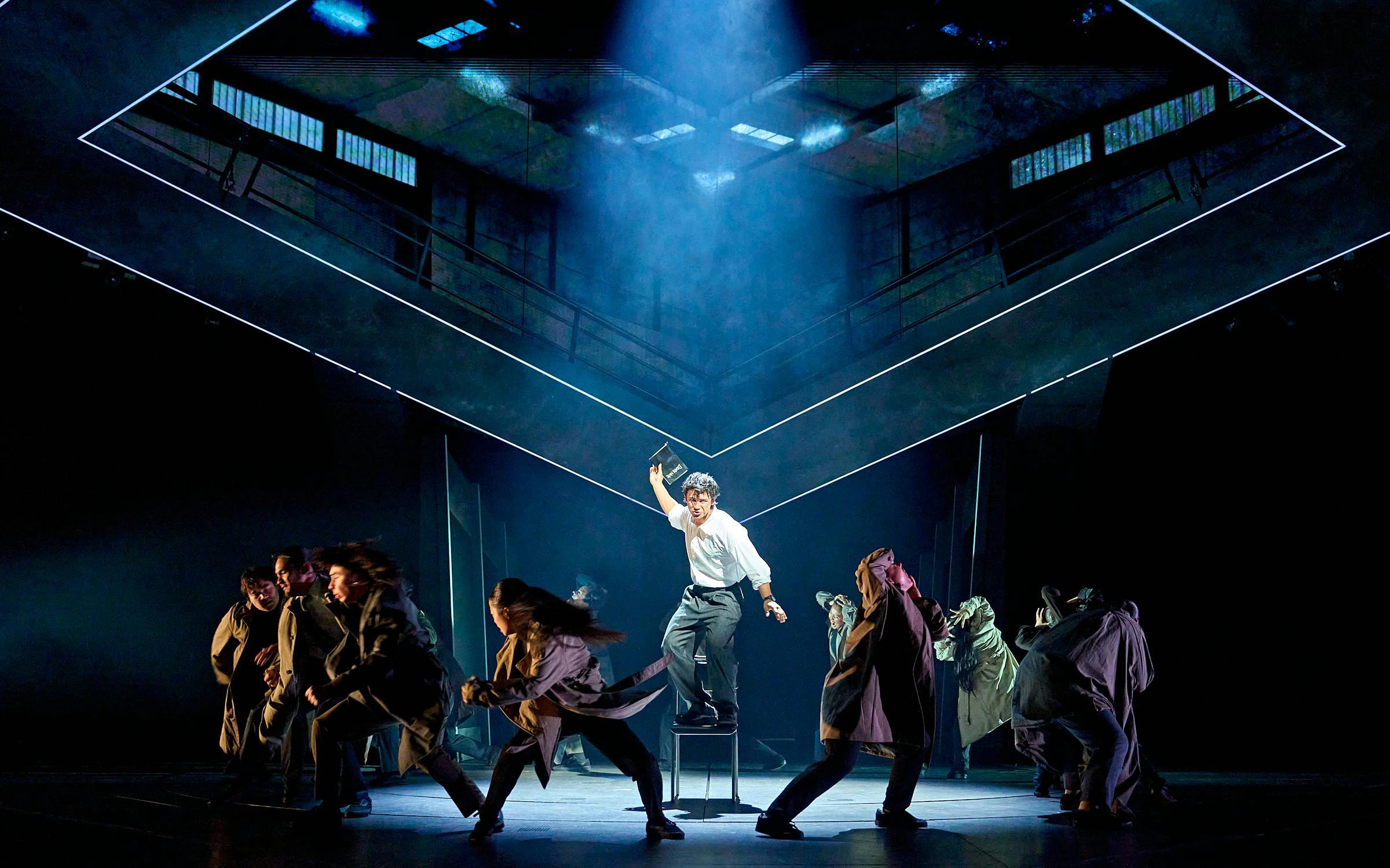 Stage performance of Death Note musical in Westend with actors in dynamic poses.