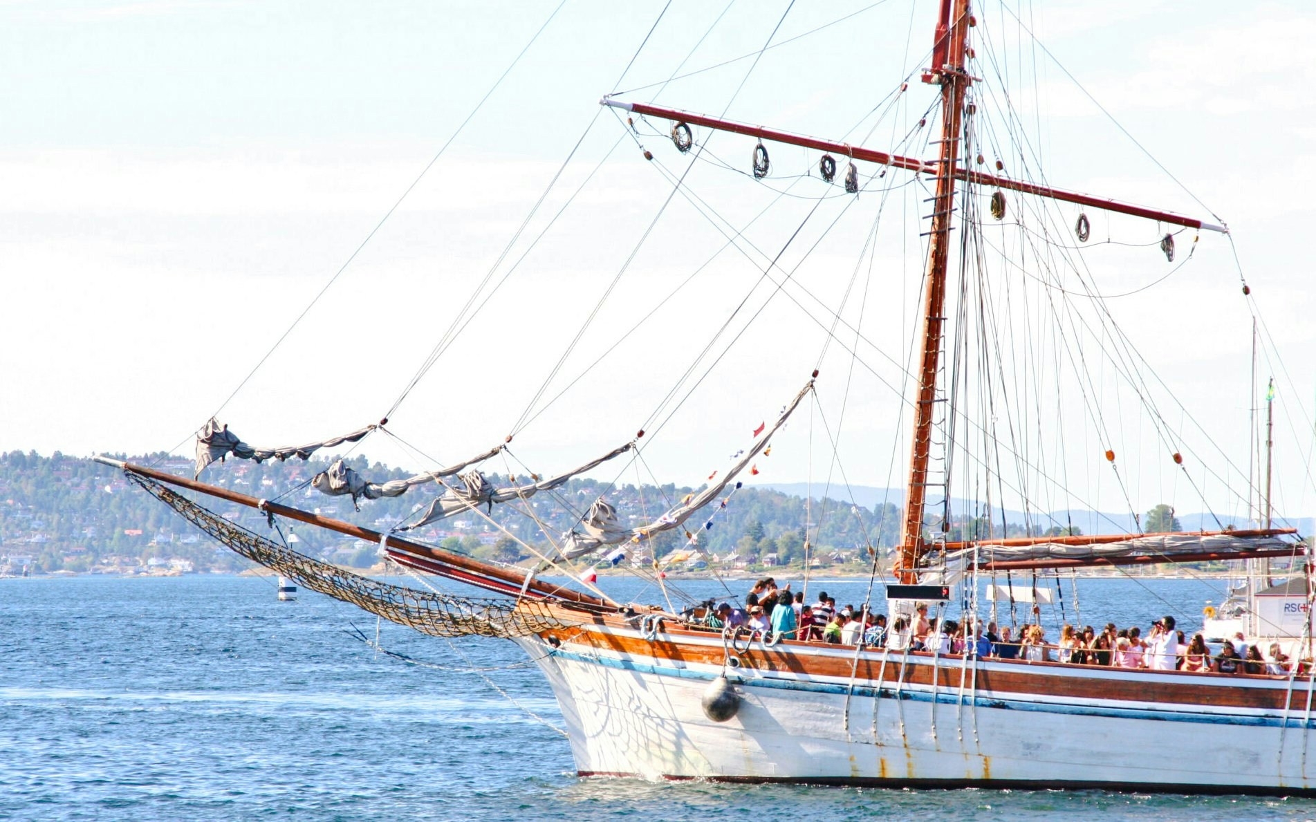Sailing ship with tourists on a fjord sightseeing cruise in Oslo.