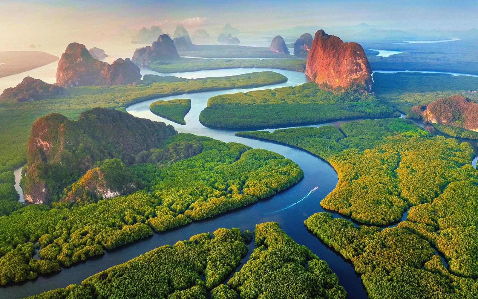 Aerial view of Phang Nga Bay with winding waterways and lush islands, Thailand.