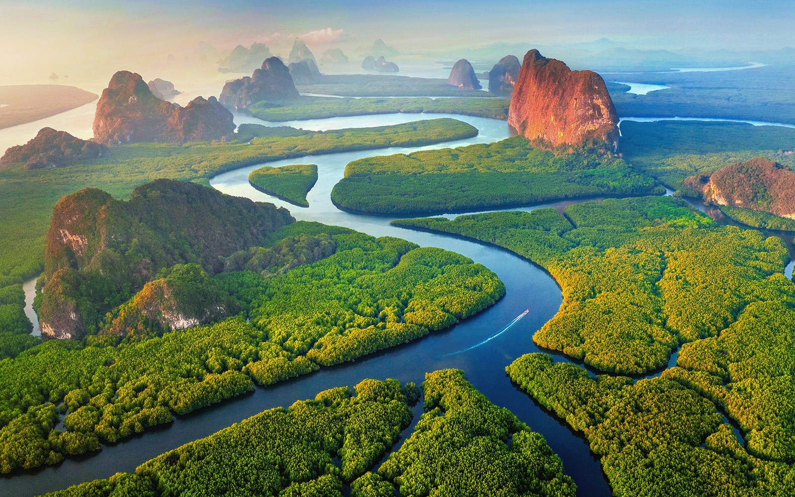 Aerial view of Phang Nga Bay with winding waterways and lush islands, Thailand.