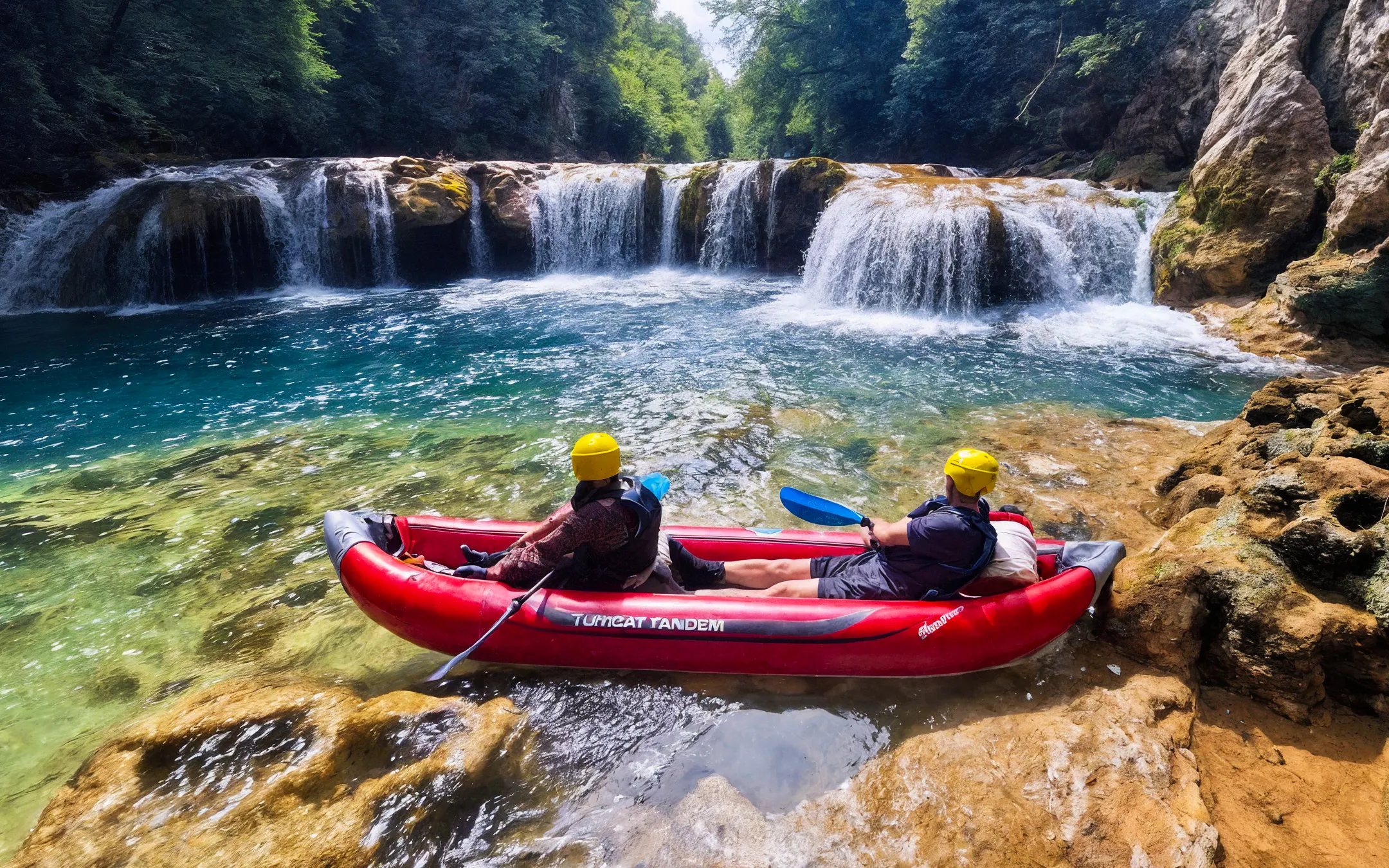 Tourists kayaking near waterfalls in Mrežnica Canyon, Split.