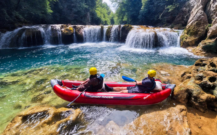 Tourists kayaking near waterfalls in Mrežnica Canyon, Split.