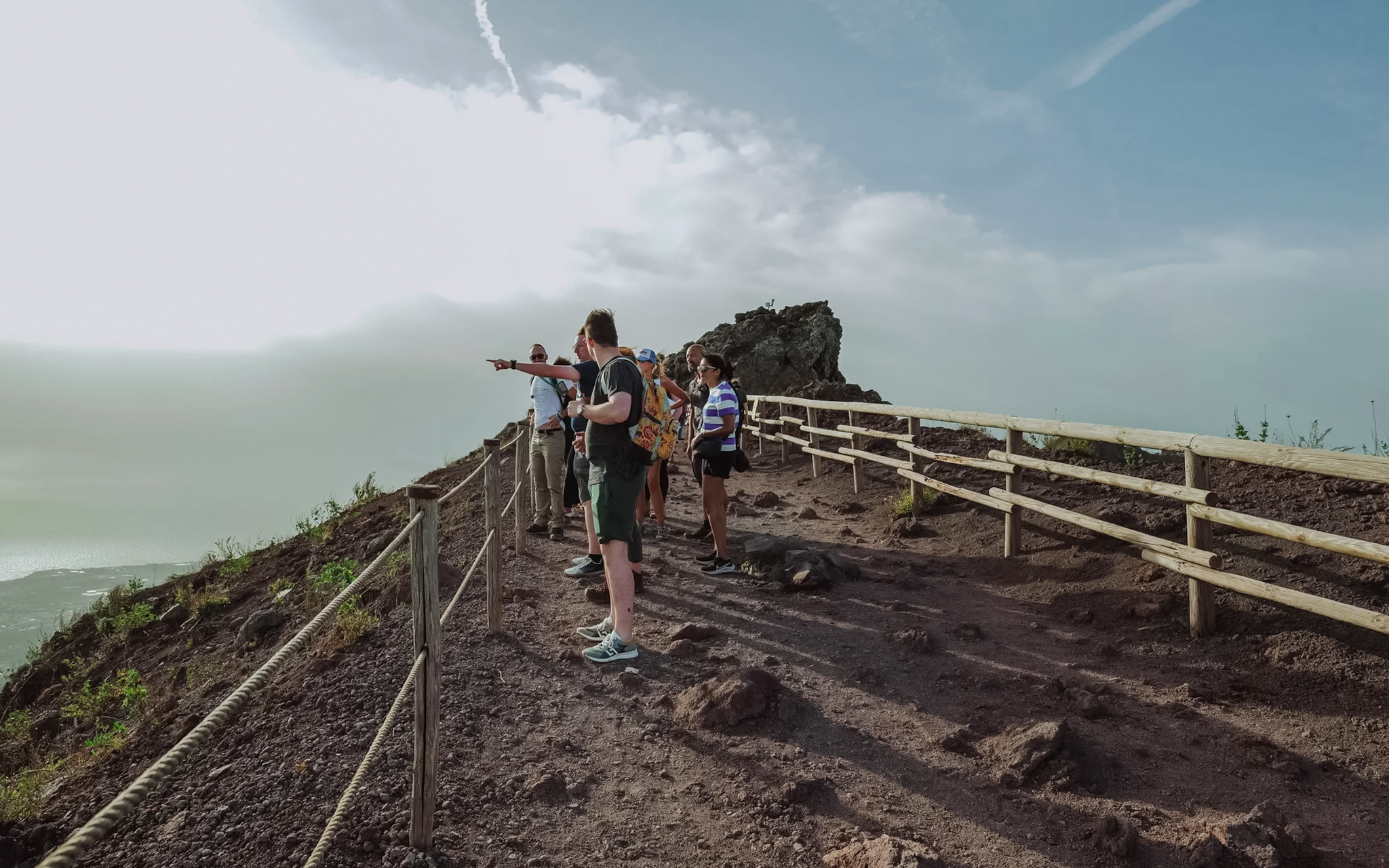 Visitors exploring the summit of Mount Vesuvius, Italy.
