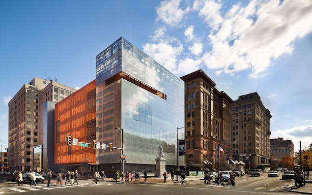 National Museum of American Jewish History building in Philadelphia with pedestrians crossing.