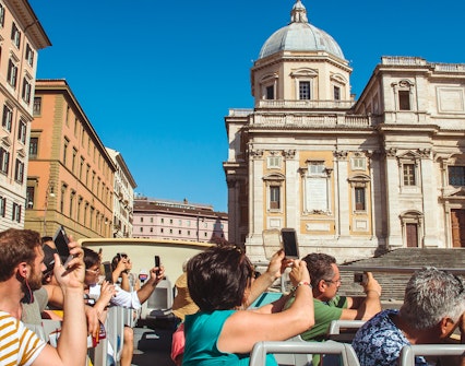 Tourists on Big Bus Tours Rome photographing Basilica di Santa Maria Maggiore.