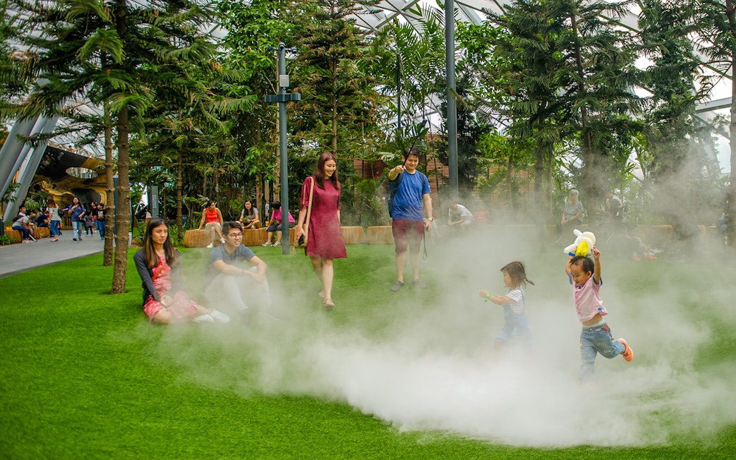 Children playing in mist at Foggy Bowls, Canopy Park, Jewel Changi.