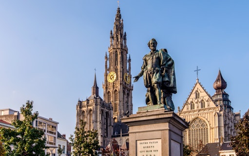 Statue of Pieter Paul Rubens with Cathedral of Our Lady in Antwerp, Belgium.
