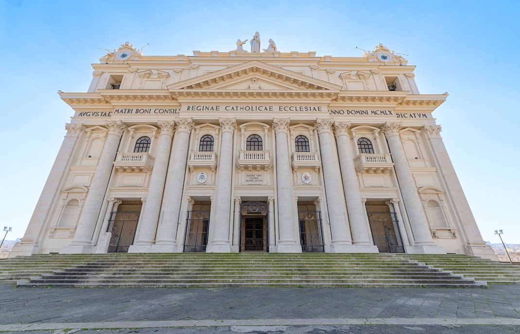 Madre del Buon Consiglio Basilica exterior with intricate architectural details in Naples, Italy.