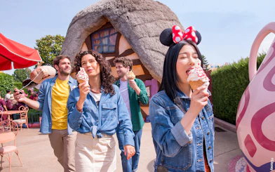 Visitors enjoying ice cream at a themed restaurant in Disneyland Paris.