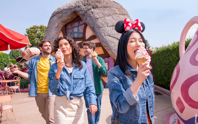 Visitors enjoying ice cream at a themed restaurant in Disneyland Paris.