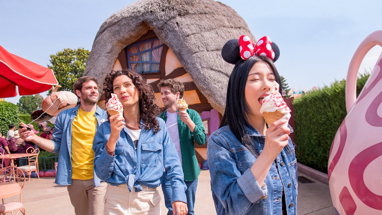 Visitors enjoying ice cream at a themed restaurant in Disneyland Paris.