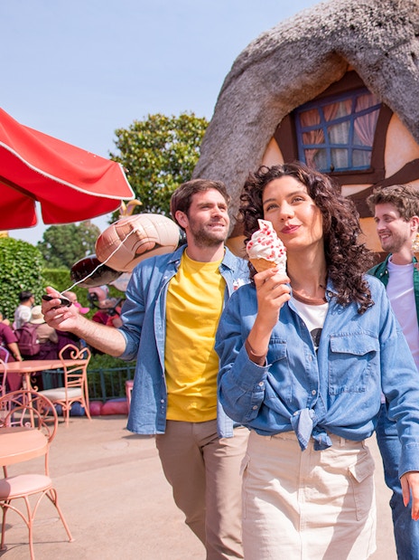 Visitors enjoying ice cream at a themed restaurant in Disneyland Paris.