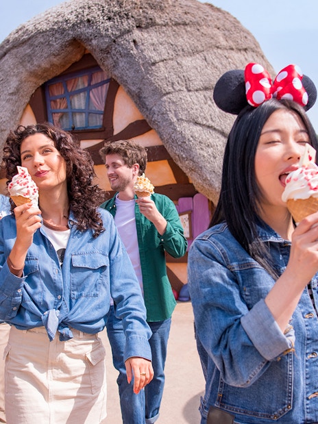 Visitors enjoying ice cream at a themed restaurant in Disneyland Paris.
