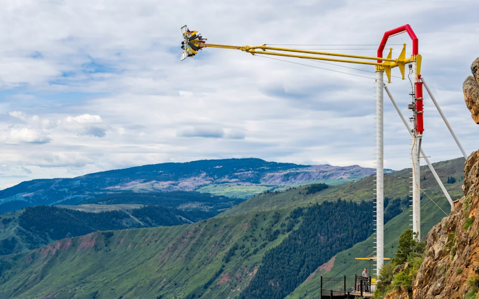 Thrill ride at Glenwood Caverns Adventure Park with mountain views.
