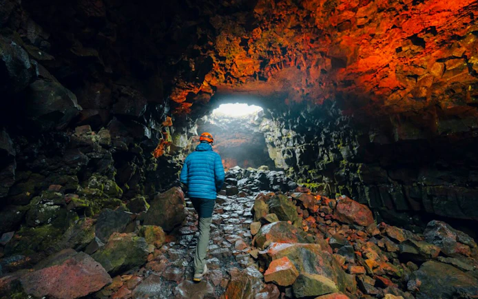 Guests exploring Raufarhólshellir Lava Tunnel in Iceland.
