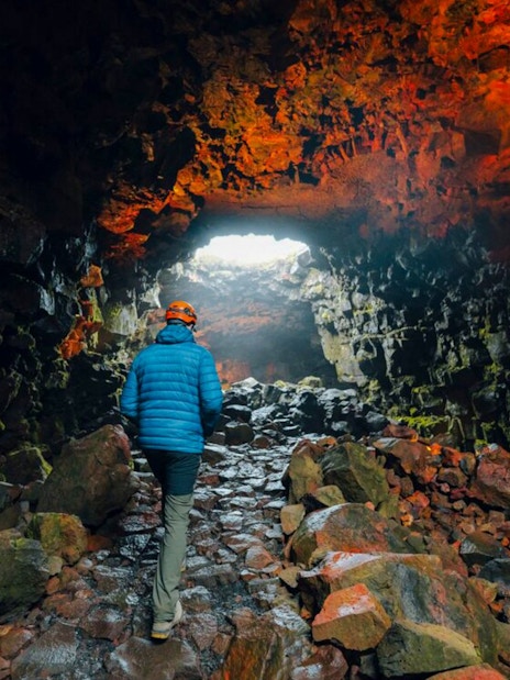 Guests exploring Raufarhólshellir Lava Tunnel in Iceland.