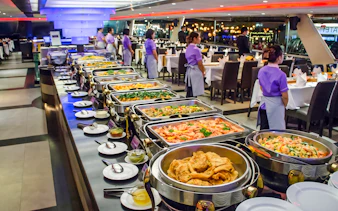 Buffet setup on Chao Phraya Princess dinner cruise during Loy Krathong festival in Bangkok.