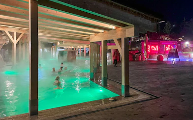 Thermal bath with people relaxing in Zakopane, Poland, during the Krakow snowmobile tour.