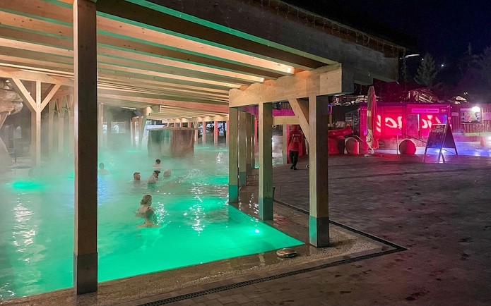 Thermal bath with people relaxing in Zakopane, Poland, during the Krakow snowmobile tour.