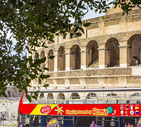 Sightseeing bus in front of the Colosseum, Rome.
